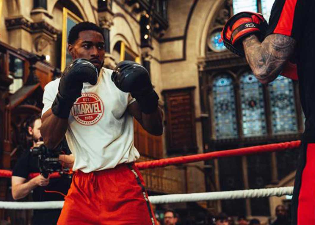 The coach is in a boxing match.